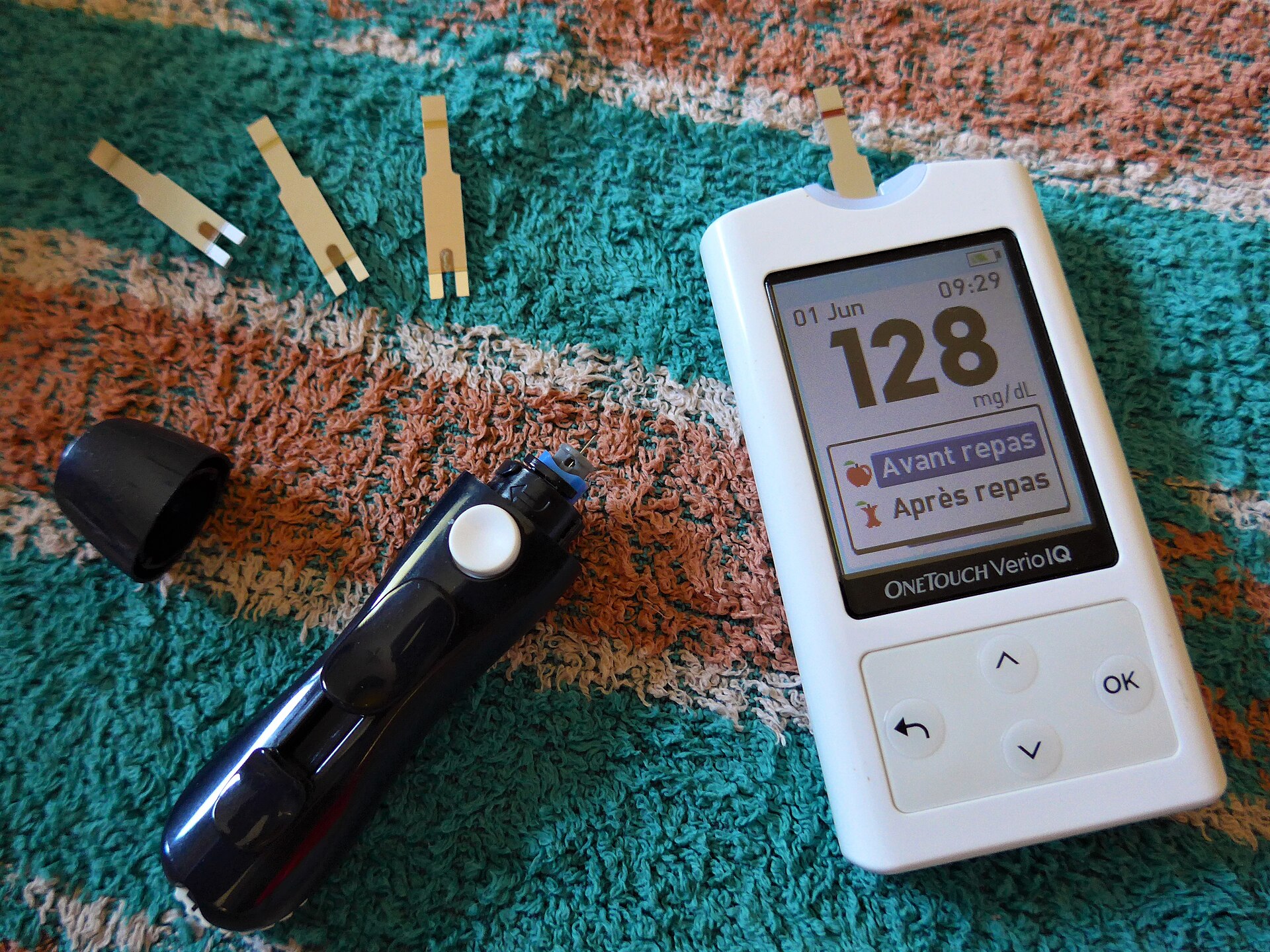 A home blood glucose meter displaying a reading