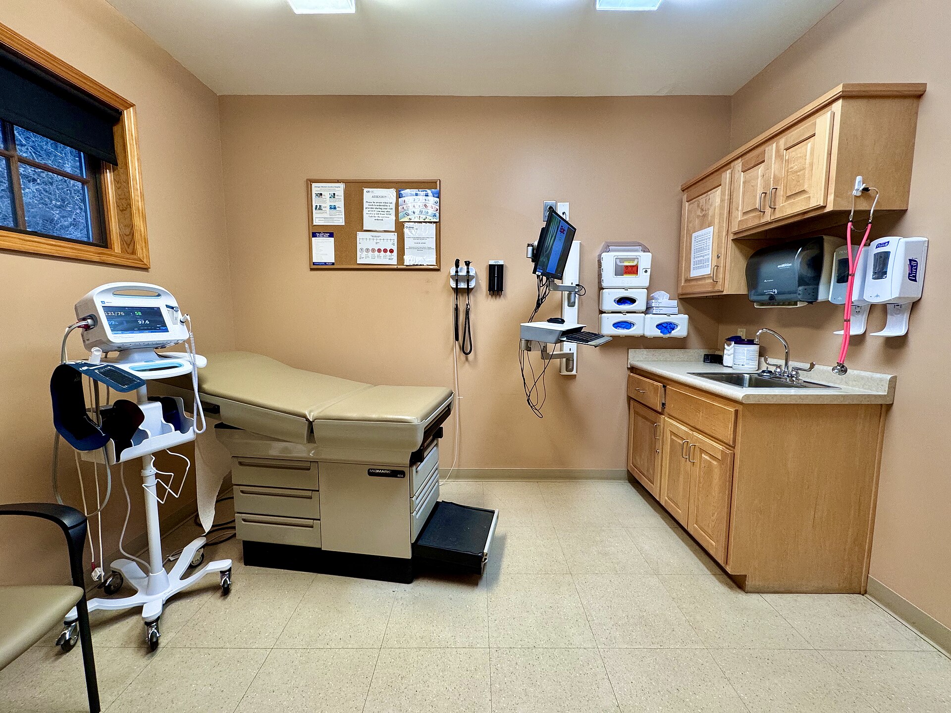 A clean, modern primary care exam room ready for a same-day visit